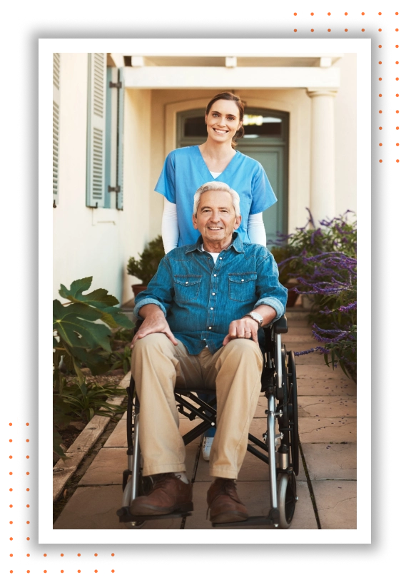 A smiling caregiver stands beside a person in a wheelchair, radiating joy and support in a heartwarming moment of companionship and care.